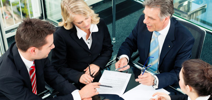 Business people meeting around a conference table