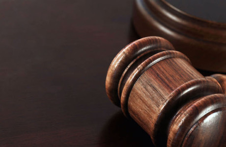 Judge's gavel resting on a desk